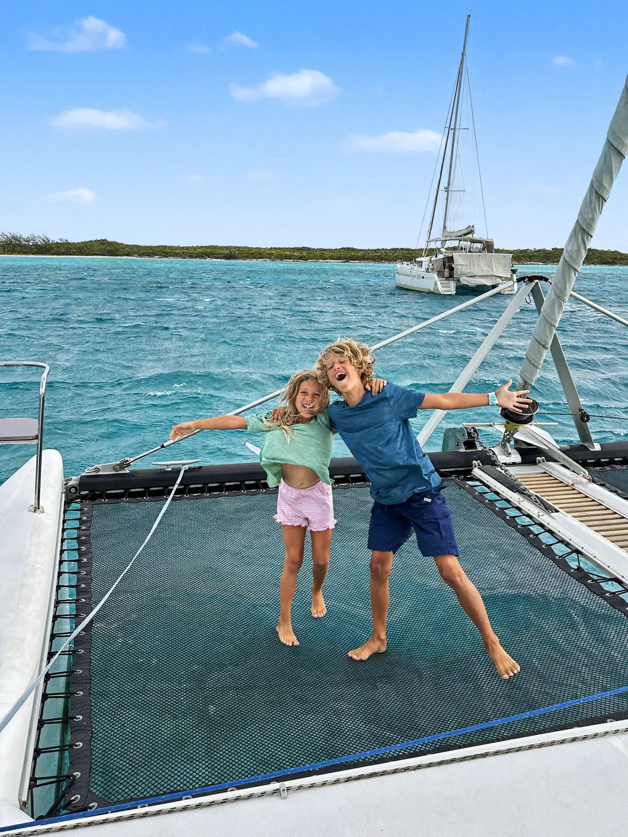 The owner's family in the cockpit of S/V Tropicalia, a 2010 Voyage 500 catamaran