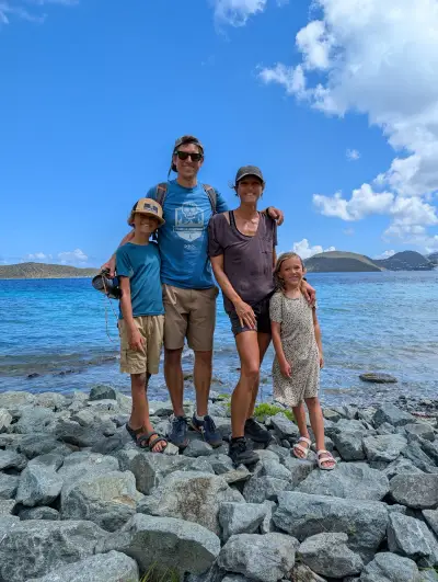 Eric, Alex, Leon, and Margot on a rocky shore in the British Virgin Islands