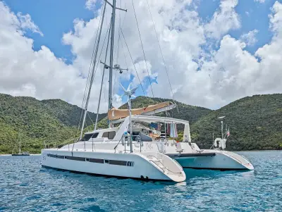 Stern quarter view of Tropicalia at anchor